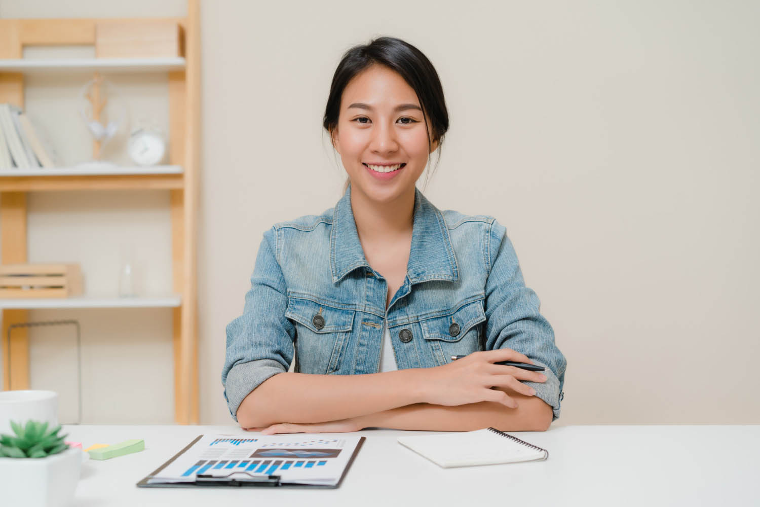 asia business woman feeling happy smiling looking camera while relax home office