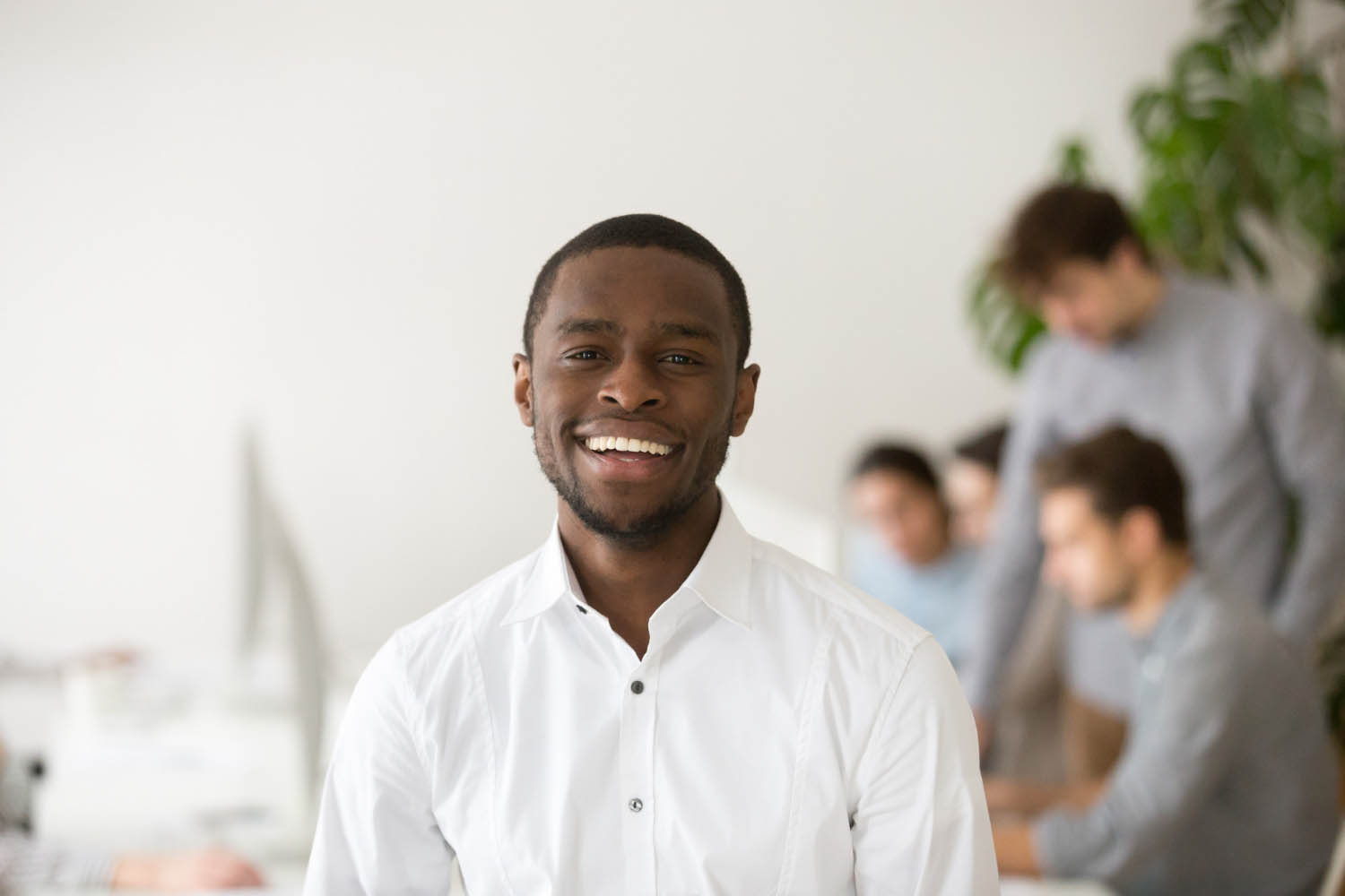 happy african american professional manager smiling looking camera headshot portrait